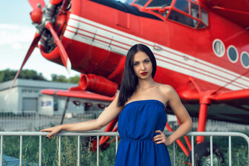Brunette in a dress at the old airport