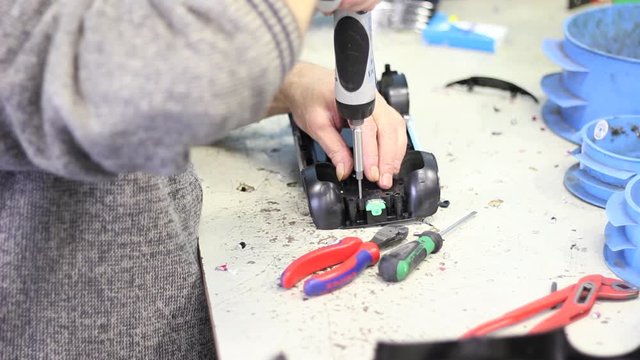 Plastic car being disassembled for recycling