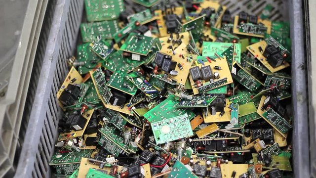 Focus rack of recycled circuit boards in basket