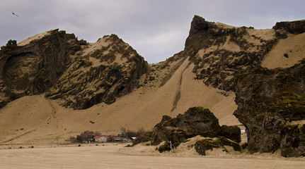 Traditional Icelandic farmhouses against the backdrop of a fantastic Icelandic landscape