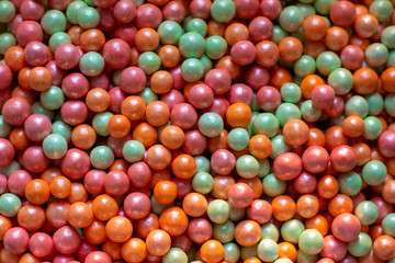 Fototapeta na wymiar Multi-colored confectionery balls. Sprinkling confectionery. Background or texture.