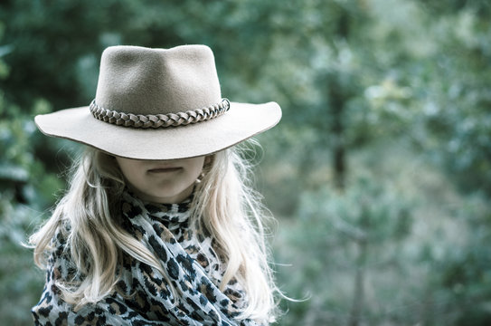 little child  with hat covering eyes