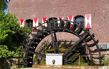 Brüggen, Germany: View on medieval watermill with paddle wheel in small german village
