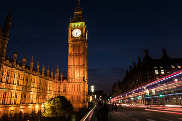 Fototapeta na wymiar Big Ben London England at night and Bus and Car Light Trails