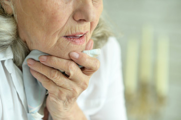 Close up portrait of sick senior woman