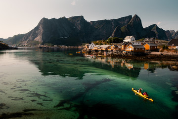 kayaking in lofoten islands. kayaking in Reine, lofoten islands - obrazy, fototapety, plakaty