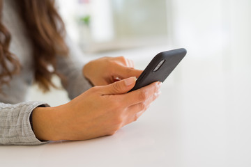 Close up of woman hands using smartphone