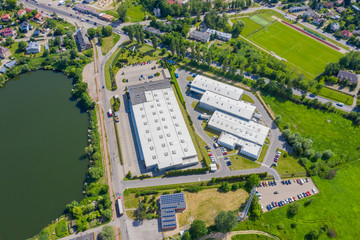 Aerial view of goods warehouse. Logistics center in industrial city zone from above. Aerial view of...