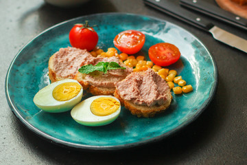 Breakfast snack, tasty food (pate, toast, tomato, corn, egg, coffee). top view. food background. copy space
