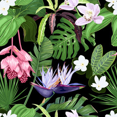 Fashionable seamless pattern with tropical flowers and leaves on a dark background. Orchids, medinilla, white strelitzia, tiara flower, palm leaves.