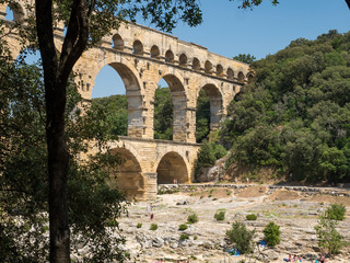 France, July 2019: The beautiful nature of southern France with its famous landmark roman bridge...