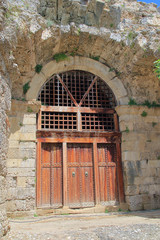 Old gate at the entrance to the ancient Roman amphitheater in the city of Side.