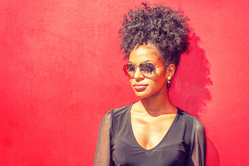 Portrait of Young African American Woman in New York City. Young black woman with afro hairstyle...