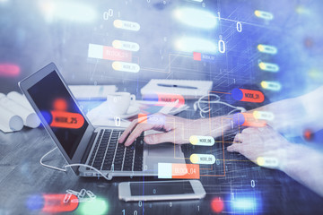 Businessman with computer background with technology theme hologram. Concept of hightech. Multi exposure.