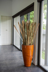 orange vase and leaf in modern house