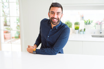 Handsome man smiling cheerful with a big smile on face showing teeth, positive and happy expression