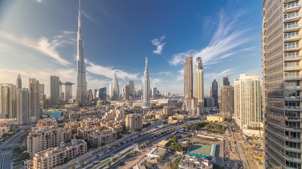 Dubai Downtown skyline timelapse with Burj Khalifa and other towers paniramic view from the top in...