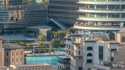 Famous musical fountain in Dubai with skyscrapers in the background aerial timelapse