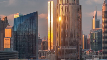 Aerial sunset cityscape with architecture of Dubai downtown timelapse, United Arab Emirates.