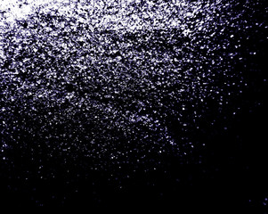 Beautiful white glitter texture on the black background and light glitter sparkle confetti gray grainy abstract texture on a black background and wallpaper