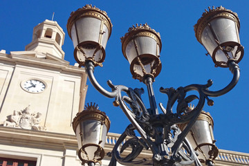 Fototapeta na wymiar Closeup of historic street lamp in front of the town hall of Reus on the Plaça del Mercadal, Tarragona province, Spain, Europe