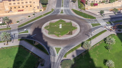 Aerial view of a roundabout circle road in Dubai downtown from above timelapse. Dubai, United Arab...