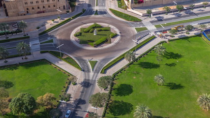 Aerial view of a roundabout circle road in Dubai downtown from above timelapse. Dubai, United Arab...