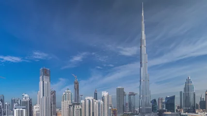 Naadloos Fotobehang Airtex Burj Khalifa Dubai Downtown skyline timelapse with Burj Khalifa and other towers paniramic view from the top in Dubai