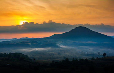 Beautiful nature landscape of the colorful sky and mountains during the sunrise at Khao Takhian Ngo View Point, Khao Kho attractions in Phetchabun, Thailand