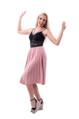 Excited cheerful young blonde stylish fashionable woman with raised arms. Full body isolated on white background. 