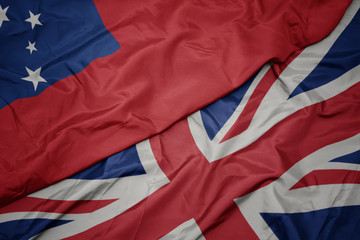 waving colorful flag of great britain and national flag of Samoa.