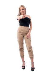 Happy smiling pretty blonde woman in elegant clothes pointing finger at camera choosing you. Full body isolated on white background. 