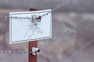 Danger High Voltage warning sign on an electrified fence