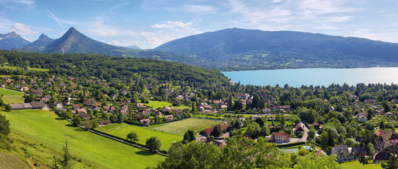 Scenic view of mountains and scattering houses from Menthon castle in Haute-Savoie - obrazy, fototapety, plakaty