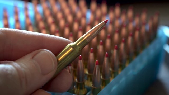 Inspecting a new rifle cartridge