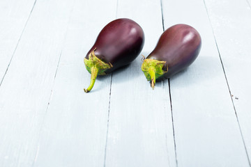 eggplants on shabby chic bright wood table