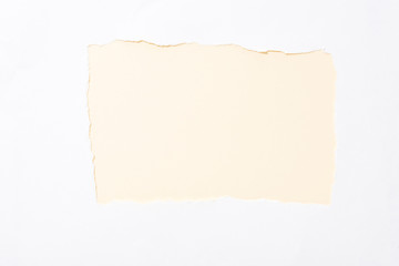Obraz premium pastel beige colorful background in white torn paper hole