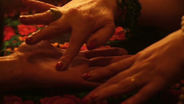 Fortune Teller Predicts Fate Reading Lines On The Hand