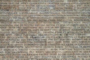 Naklejka premium Latin script on a panel outside the Museo dell'Ara Pacis in Rome, Italy