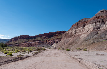 Paria Canyon landscape of dirt road and colorful striped hillsides