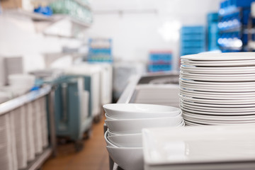 Closeup of clean plates in restaurant kitchen