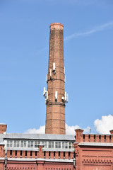 old chimney with modern antennas on it