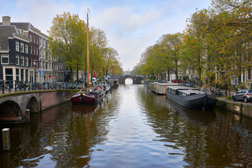 Fototapeta na wymiar View of the canal in the autumn morning in Amsterdam.