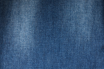 Fragment of the blue denim. Jeans background or texture.