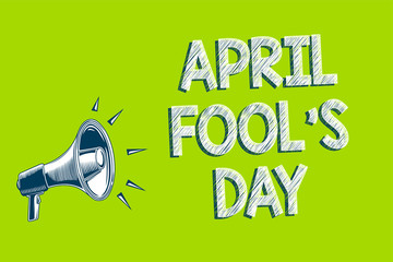 Writing note showing April Fool s is Day. Business photo showcasing Practical jokes humor pranks Celebration funny foolish Artwork convey message speaker alarm announcement green background