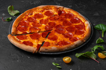 salami pizza. pepperoni pizza on black background