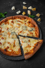 cheese pizza on black background