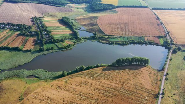 4k Aerial video view from a height, fields with ripe gold-colored wheat