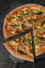 pizza with fish n black background