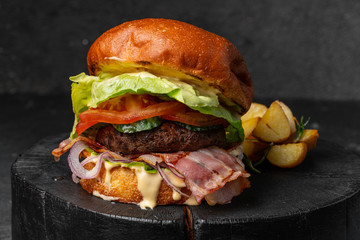 fresh tasty burger on wood table